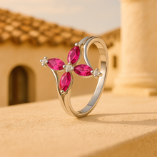 	Elegant gold-plated statement ring with red ruby and clear quartz