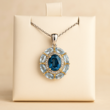 	S925 silver pendant with 18K gold and London blue topaz center stone