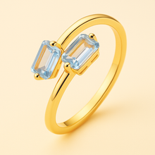 	Ring close-up on soft velvet box with golden light.