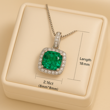 Nano emerald pendant necklace on satin cream display box