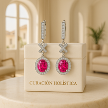 Handcrafted sterling silver earrings photographed in soft studio lighting