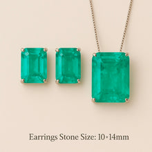 	Earrings and necklace set shown flat lay on luxury satin