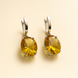 	Artisan-crafted yellow gemstone earrings in solid silver