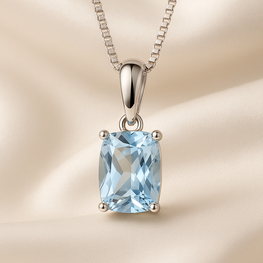 Necklace draped on a soft cream bust