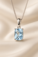 Necklace draped on a soft cream bust