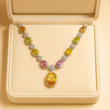 	Luxury necklace featuring citrine, peridot, and rose quartz on jewelry bust.