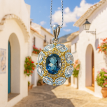 	Statement aquamarine necklace showcasing natural gemstones in Frigiliana spain between white houses 