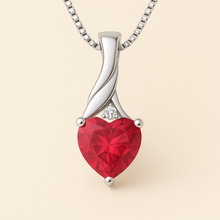 Ruby heart pendant on luxurious satin cream background