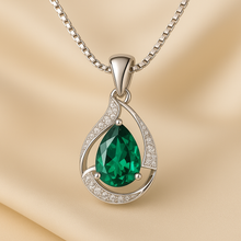 	Macro shot of crystal reflection in emerald glass-filled center stone